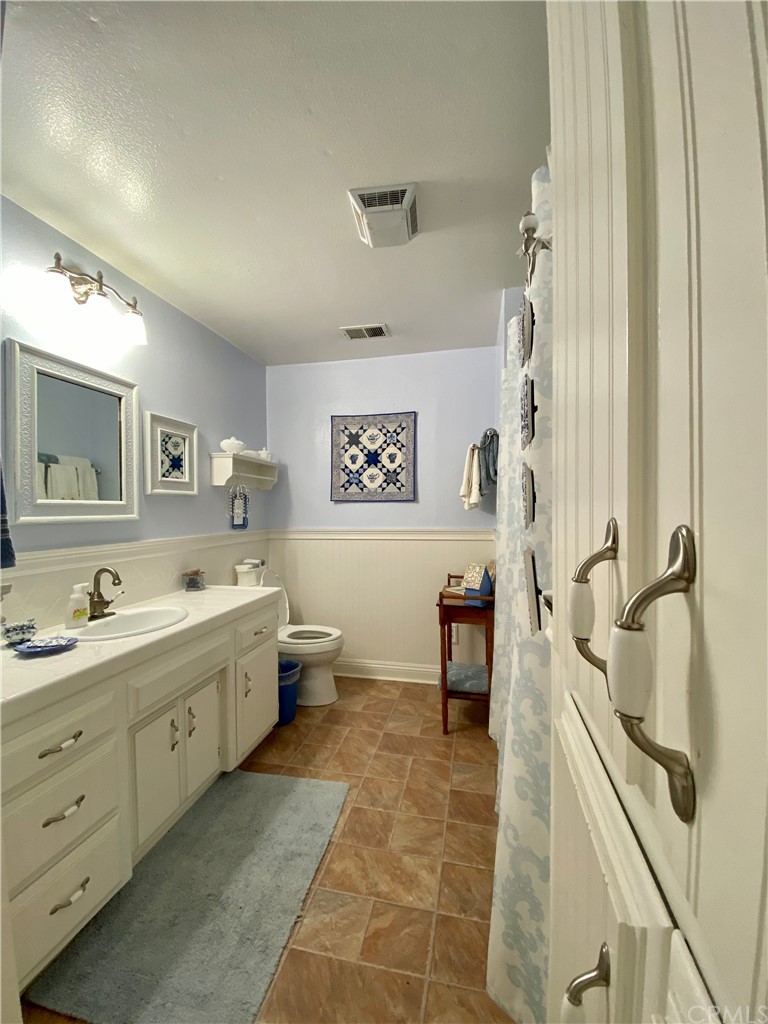 7605 San Gregorio Road Atascadero, CA 93422 - Photo 16 of 22 a spacious bathroom with a double vanity sink a mirror and a bathtub