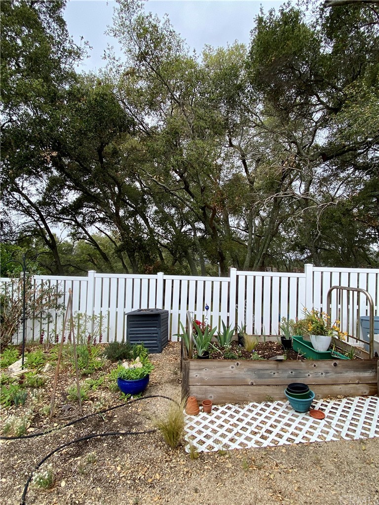7605 San Gregorio Road Atascadero, CA 93422 - Photo 20 of 22 a view of a deck with furniture and wooden fence