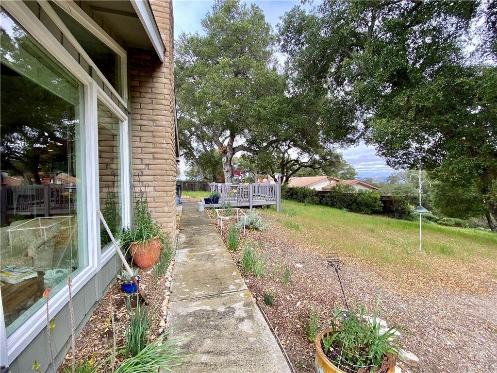 7605 San Gregorio Road Atascadero, CA 93422 - Photo 21 of 22 a backyard of a house with table and chairs