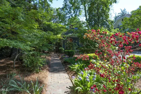 a view of backyard with outdoor seating
