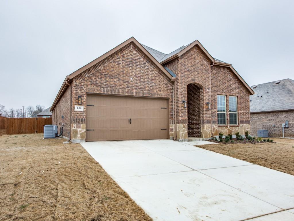 123 Lakeview Circle Pilot Point, TX 76258 - Photo 3 of 39 a front view of a house with a yard