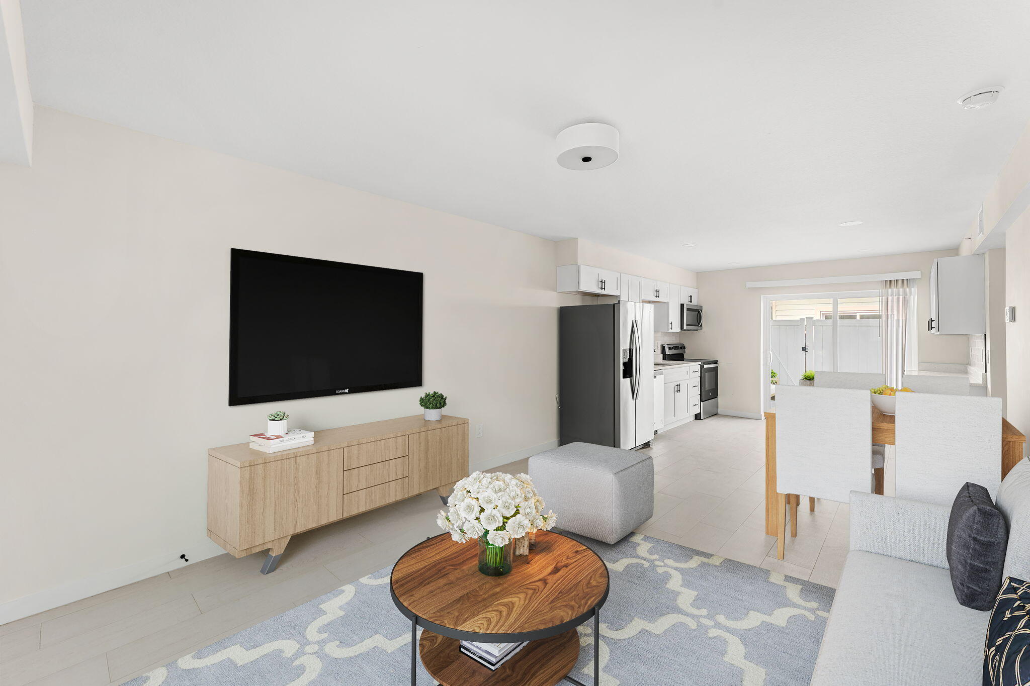 120 Central Road, Unit 213 Indian Harbour Beach, FL 32937 - Photo 2 of 12 a living room with furniture and a flat screen tv