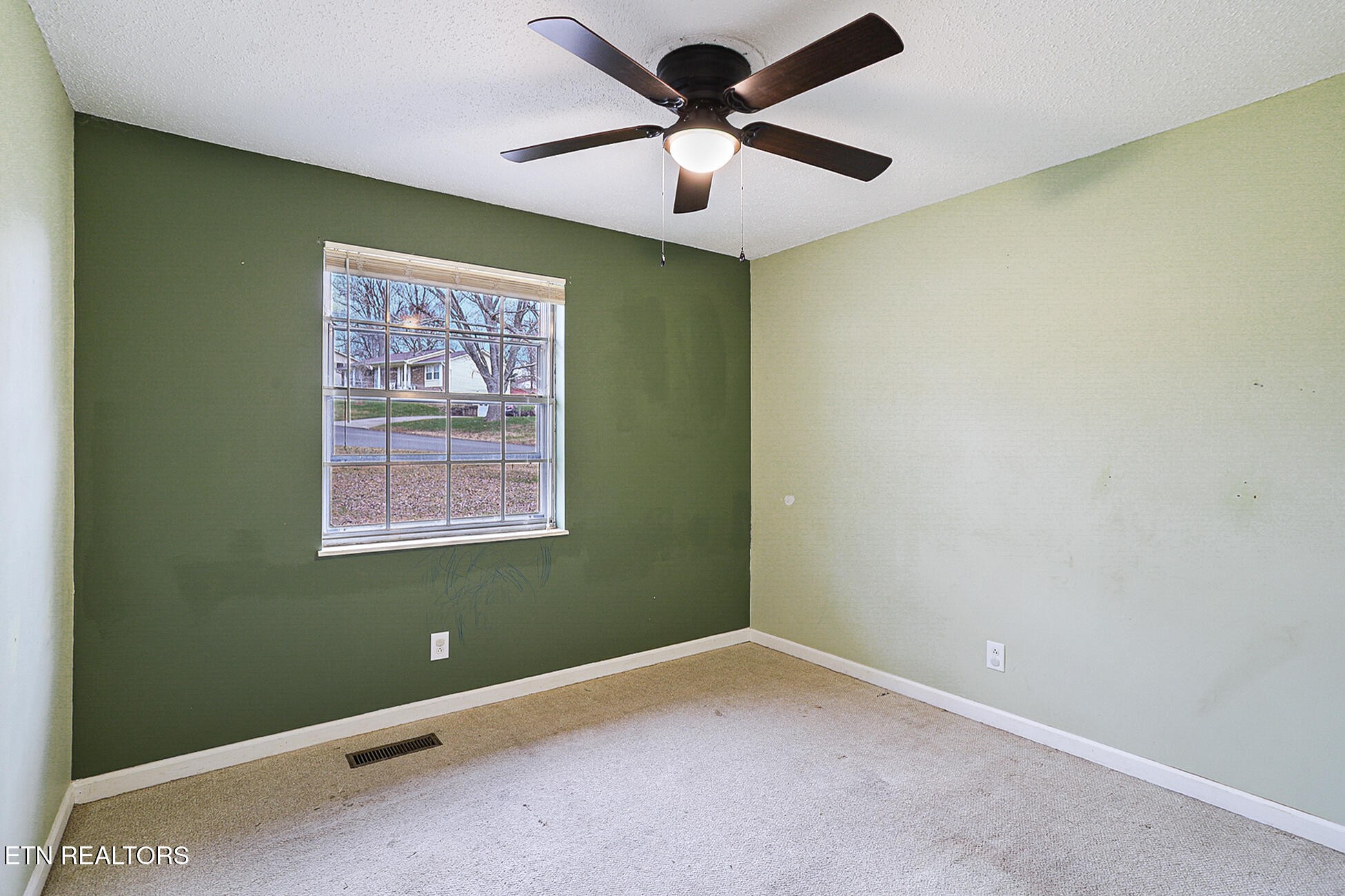 7701 Maida Vale Circle Powell, TN 37849 - Photo 14 of 36 an empty room with a window and a ceiling fan