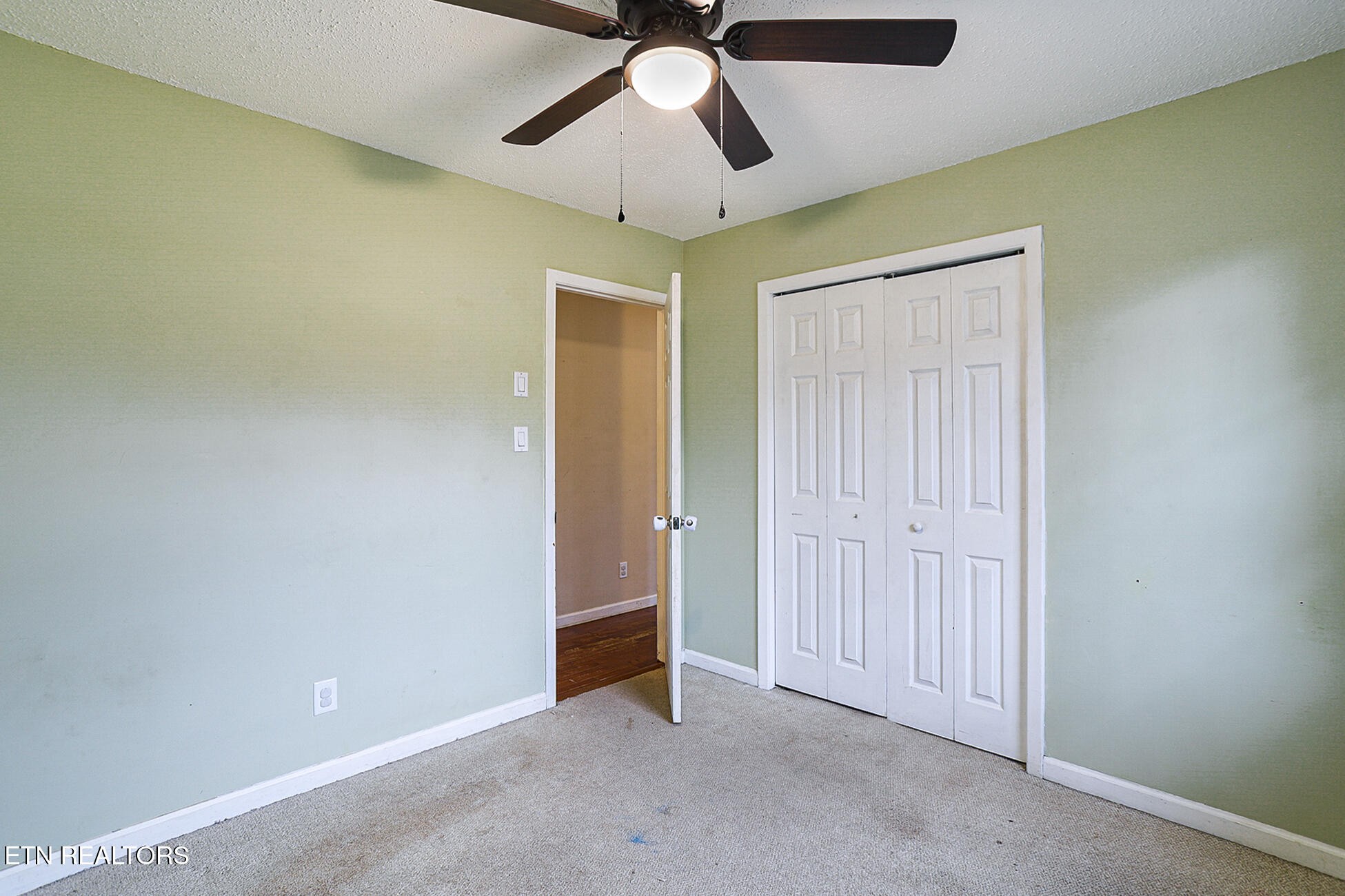 7701 Maida Vale Circle Powell, TN 37849 - Photo 16 of 36 an empty room with a ceiling fan and carpet
