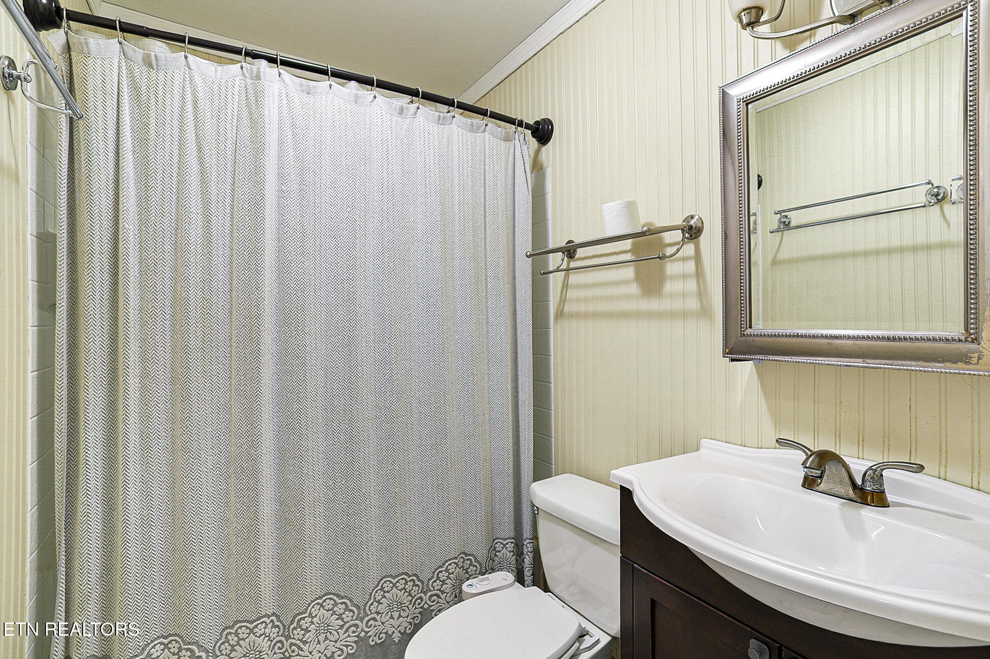7701 Maida Vale Circle Powell, TN 37849 - Photo 17 of 36 a bathroom with a sink toilet and mirror