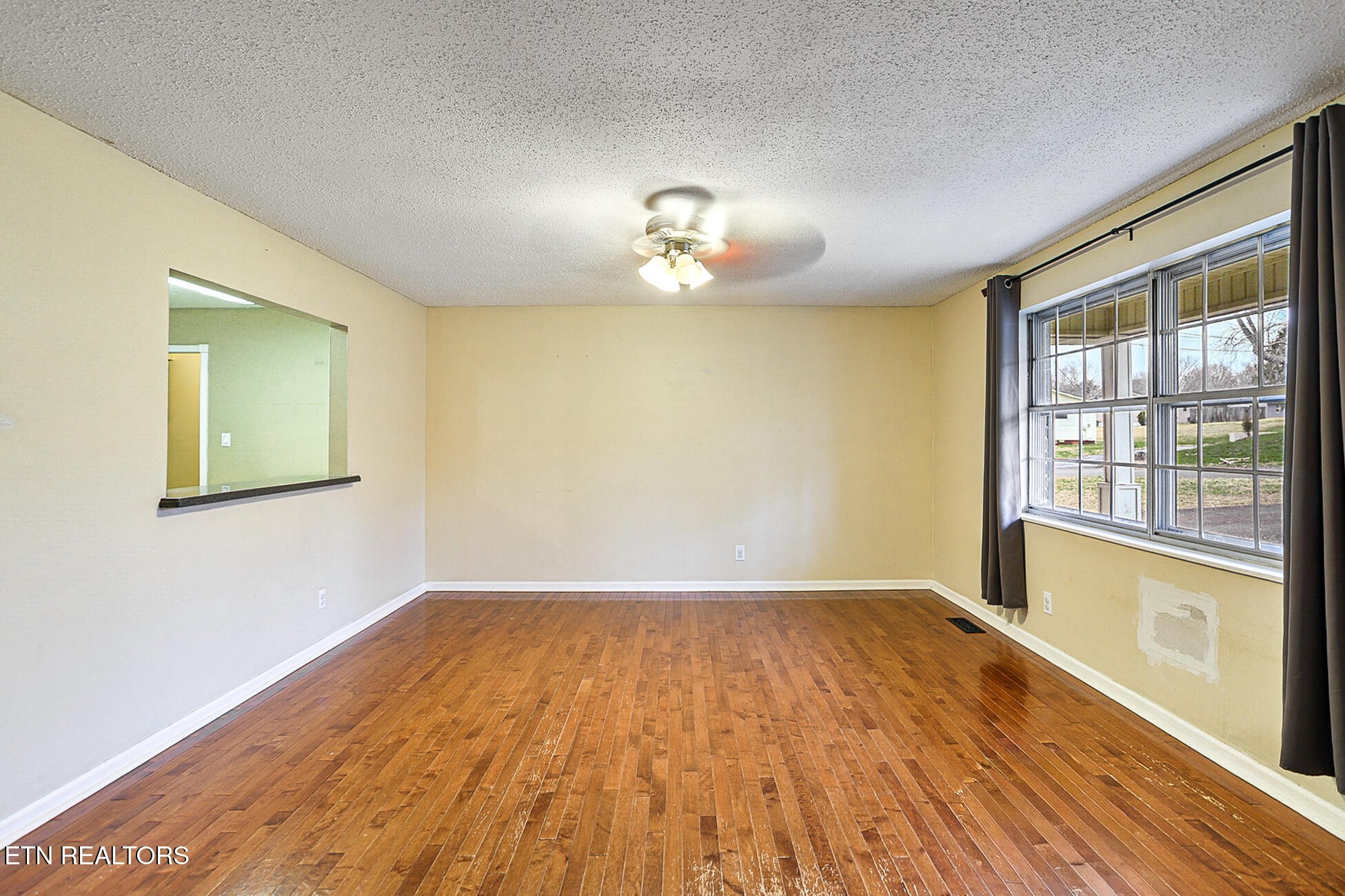 7701 Maida Vale Circle Powell, TN 37849 - Photo 3 of 36 a view of empty room with wooden floor and fan
