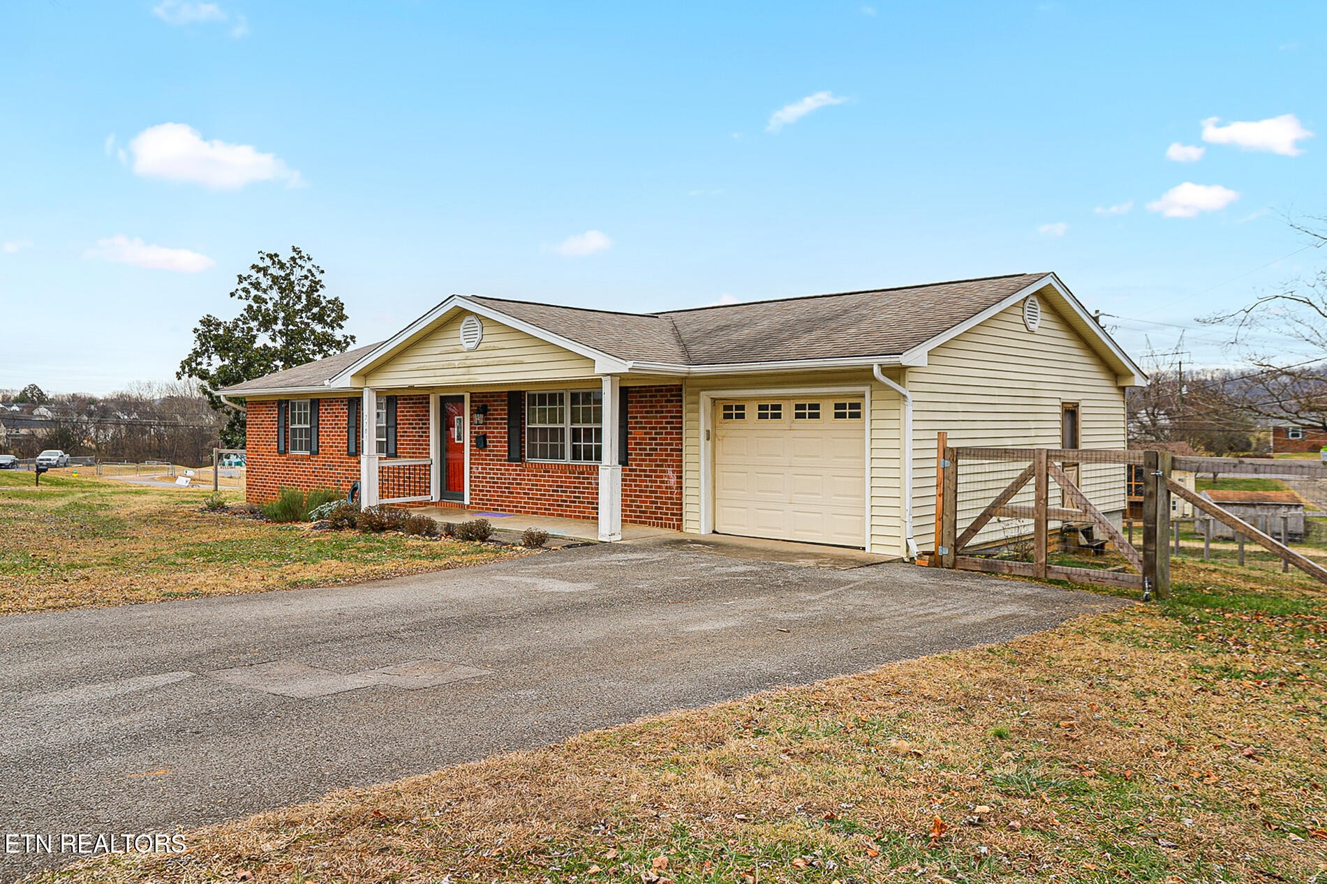 7701 Maida Vale Circle Powell, TN 37849 - Photo 35 of 36 a front view of a house with a yard and seating space