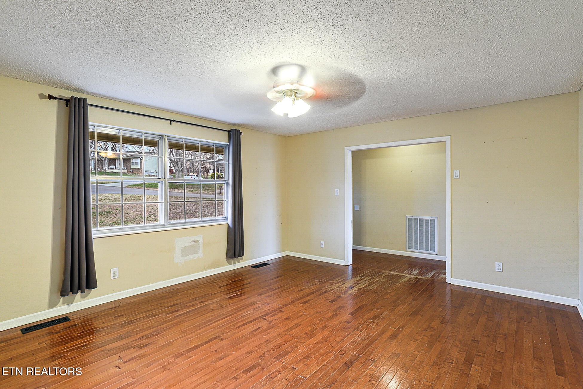 7701 Maida Vale Circle Powell, TN 37849 - Photo 4 of 36 wooden floor in an empty room with a window
