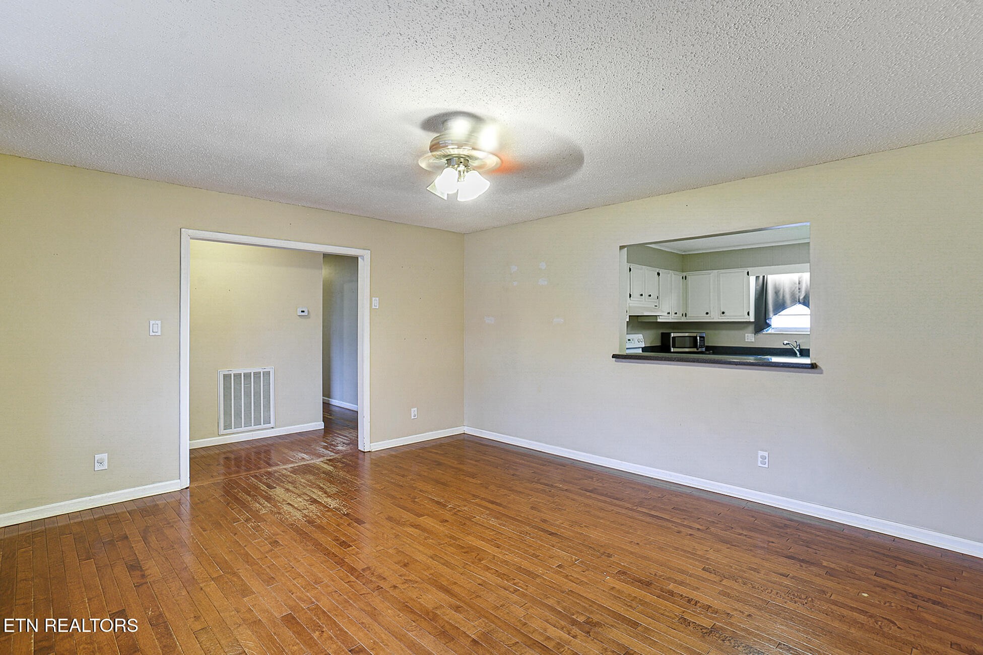 7701 Maida Vale Circle Powell, TN 37849 - Photo 5 of 36 a view of kitchen with wooden floor and window