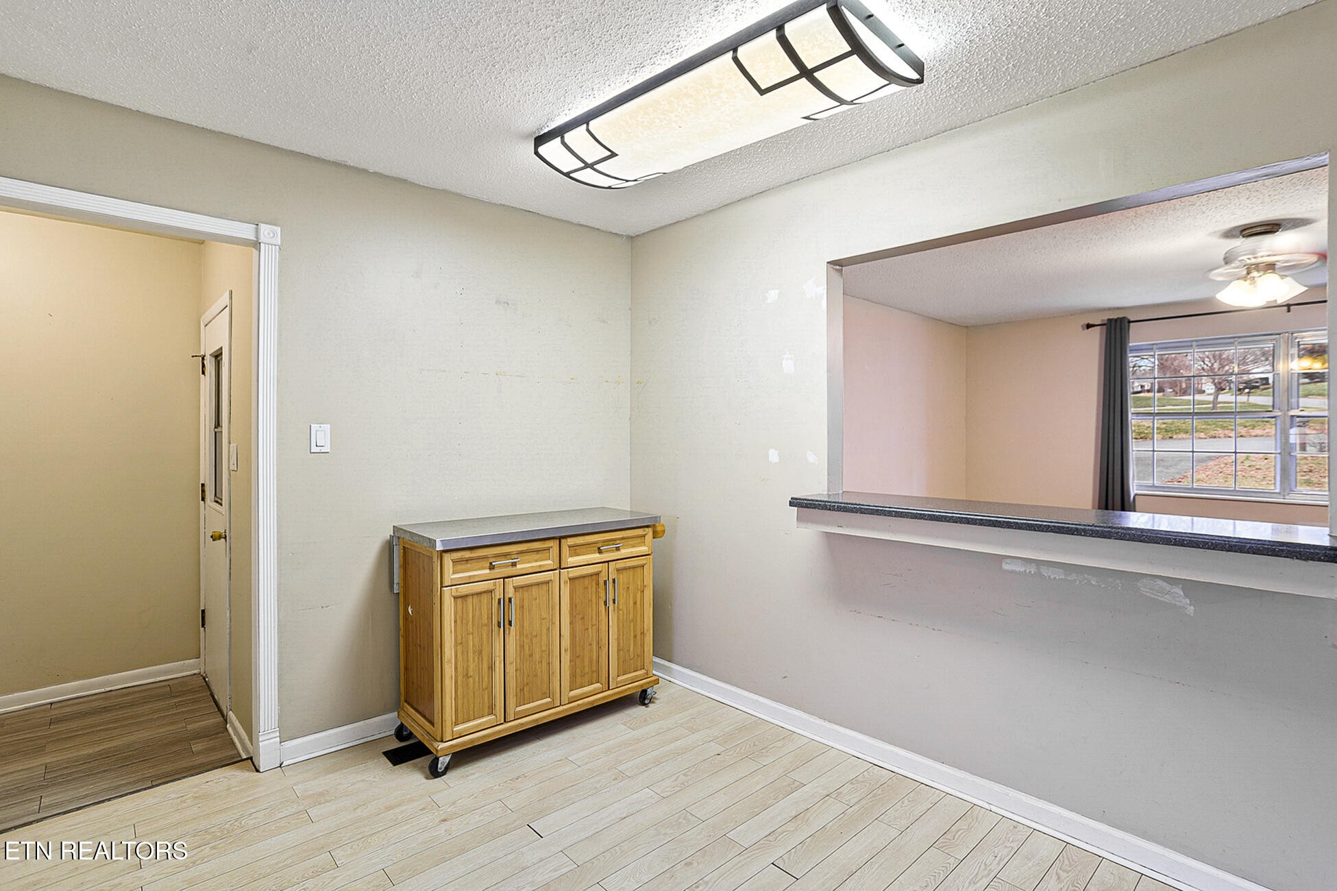 7701 Maida Vale Circle Powell, TN 37849 - Photo 10 of 36 a view of a hallway with wooden floor and windows