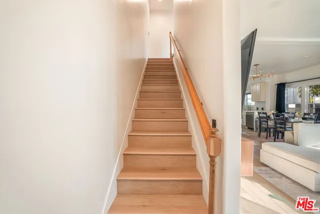 a spacious bedroom with a bed and window