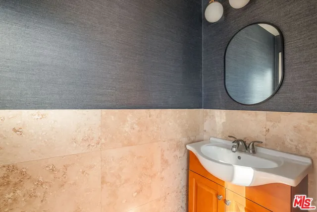 a bedroom with bed and a window