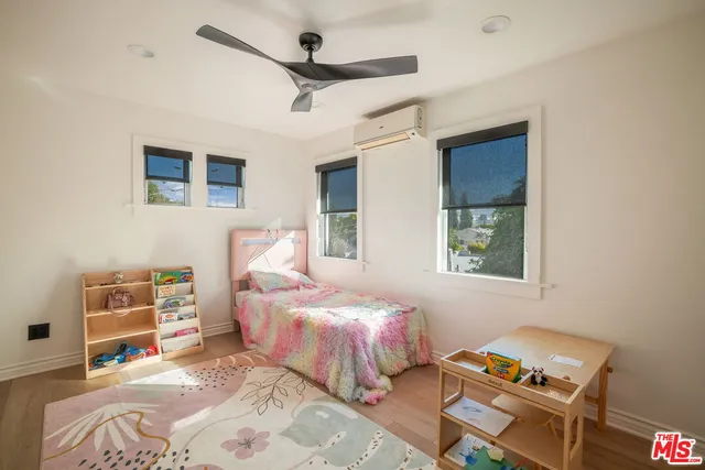 a bathroom with a shower and a glass door