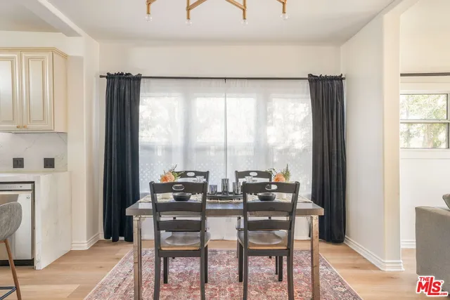 a kitchen with stainless steel appliances a refrigerator sink and cabinets