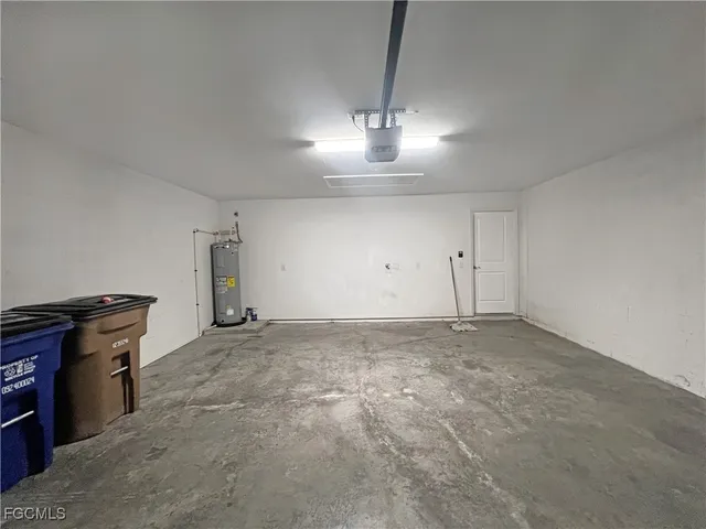 a view of empty room with chandelier