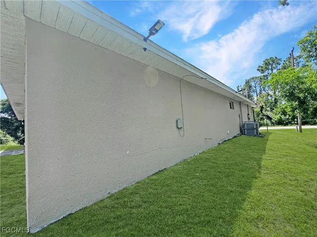 a view of a backyard with large trees