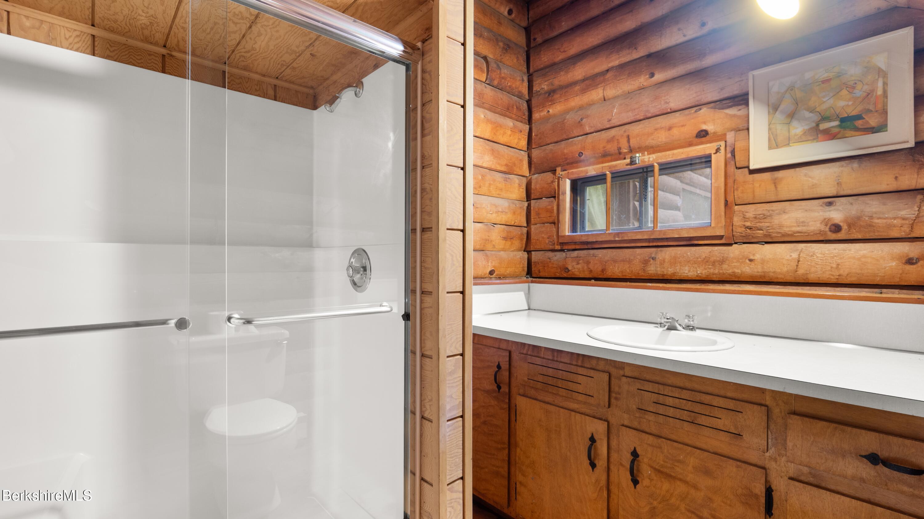 76 Corashire Road New Marlborough, MA 01230 - Photo 12 of 31 a bathroom with a sink and a shower