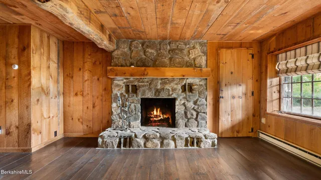 a view of a room that has a fireplace