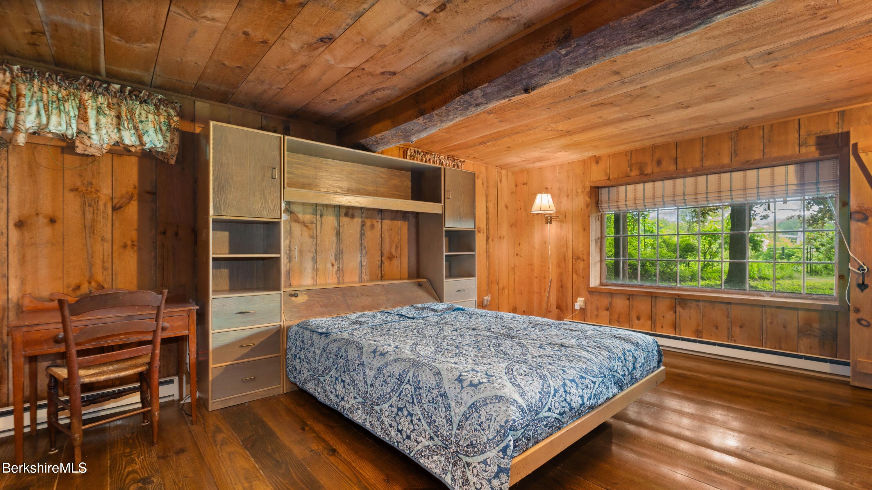 76 Corashire Road New Marlborough, MA 01230 - Photo 20 of 31 a bedroom with a bed and wooden floor