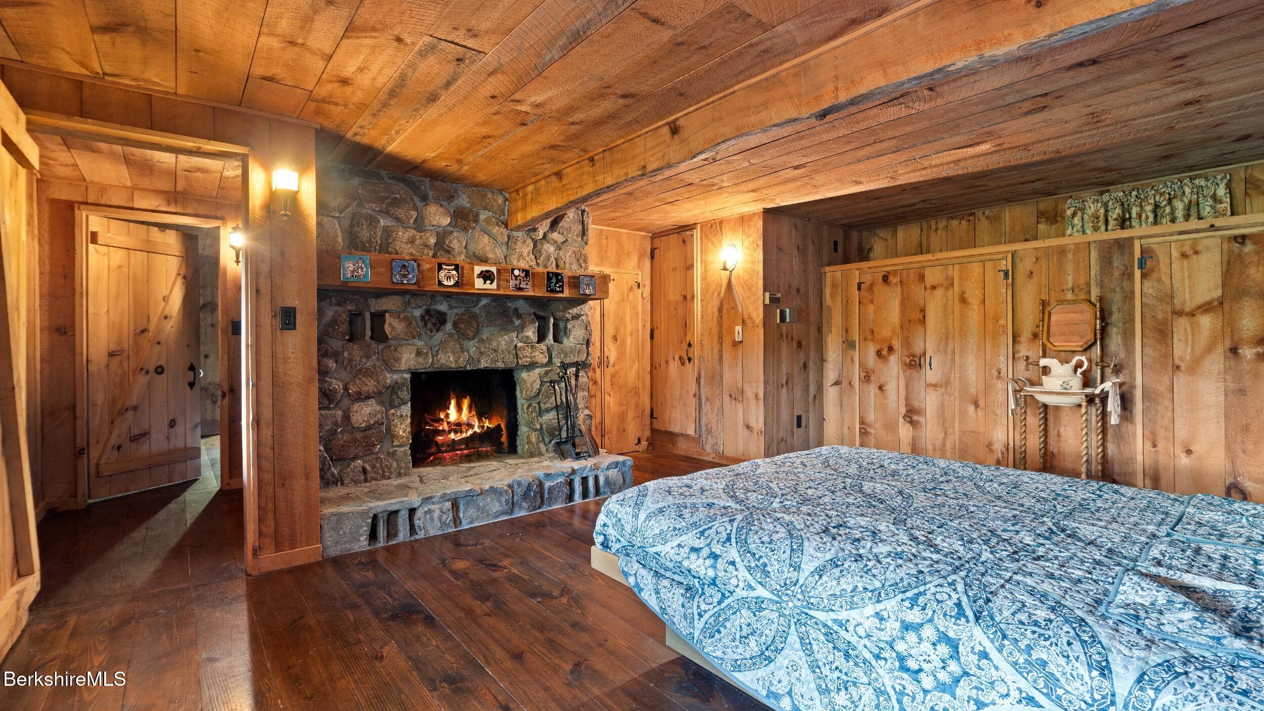 76 Corashire Road New Marlborough, MA 01230 - Photo 21 of 31 a view of a room that has a fireplace