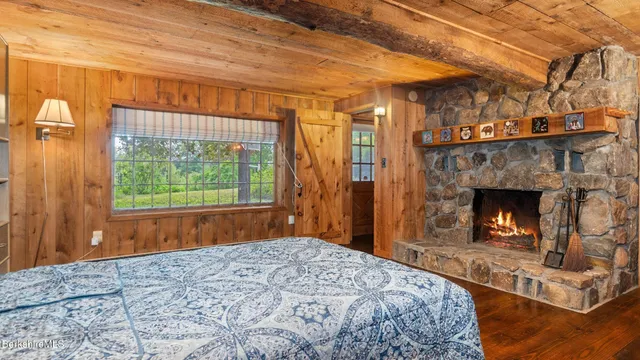 a view of an empty room and a fireplace