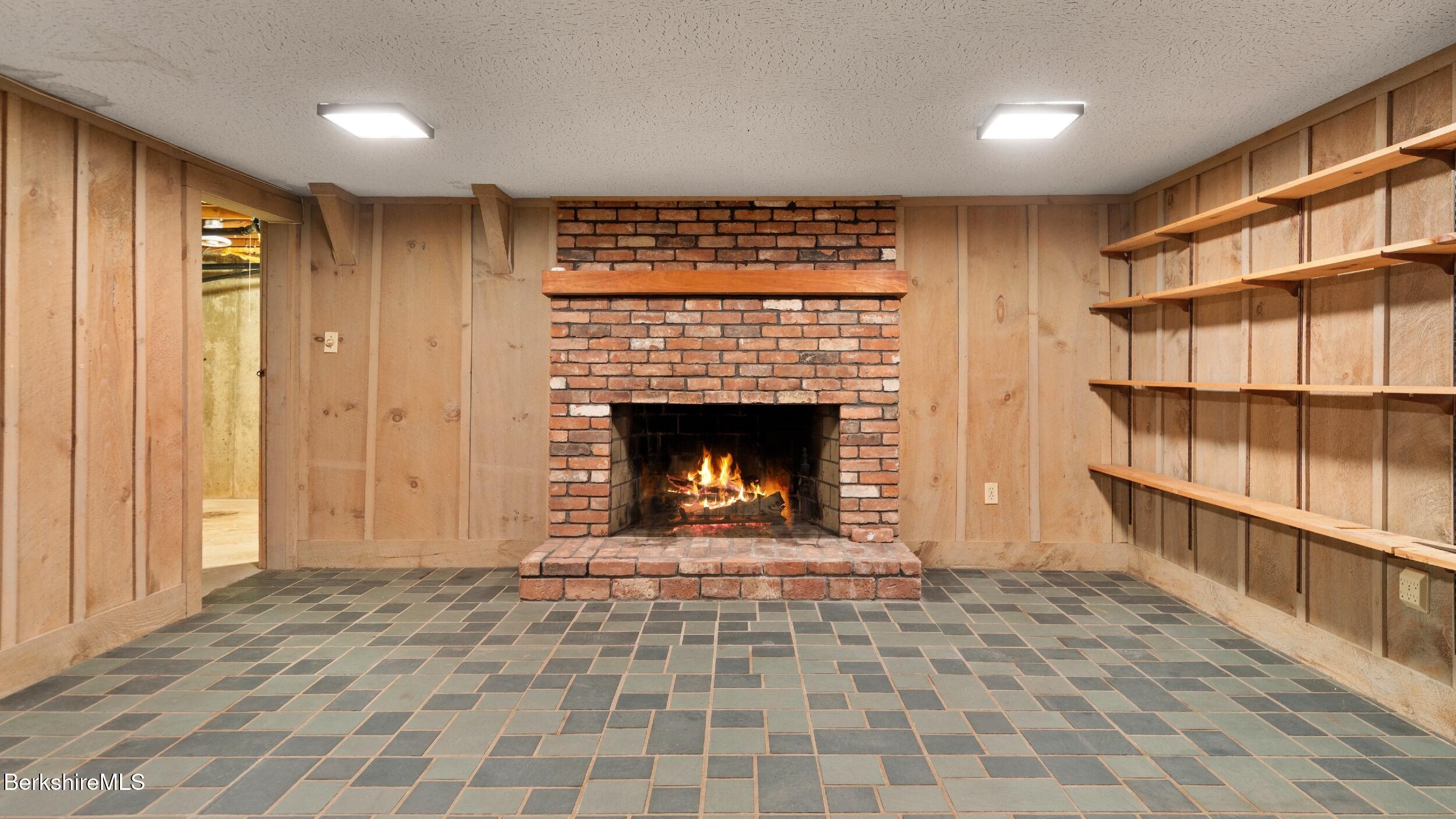 76 Corashire Road New Marlborough, MA 01230 - Photo 24 of 31 a view of an empty room and a fireplace