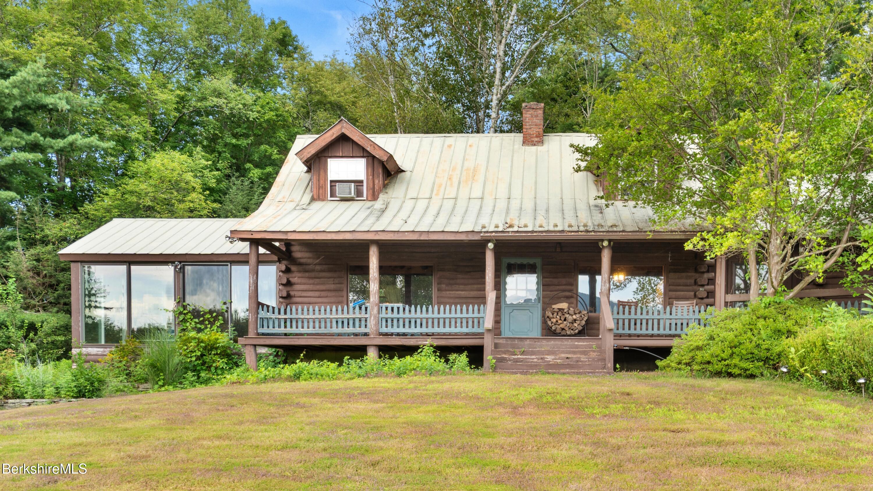 76 Corashire Road New Marlborough, MA 01230 - Photo 3 of 31 a house view with a garden space
