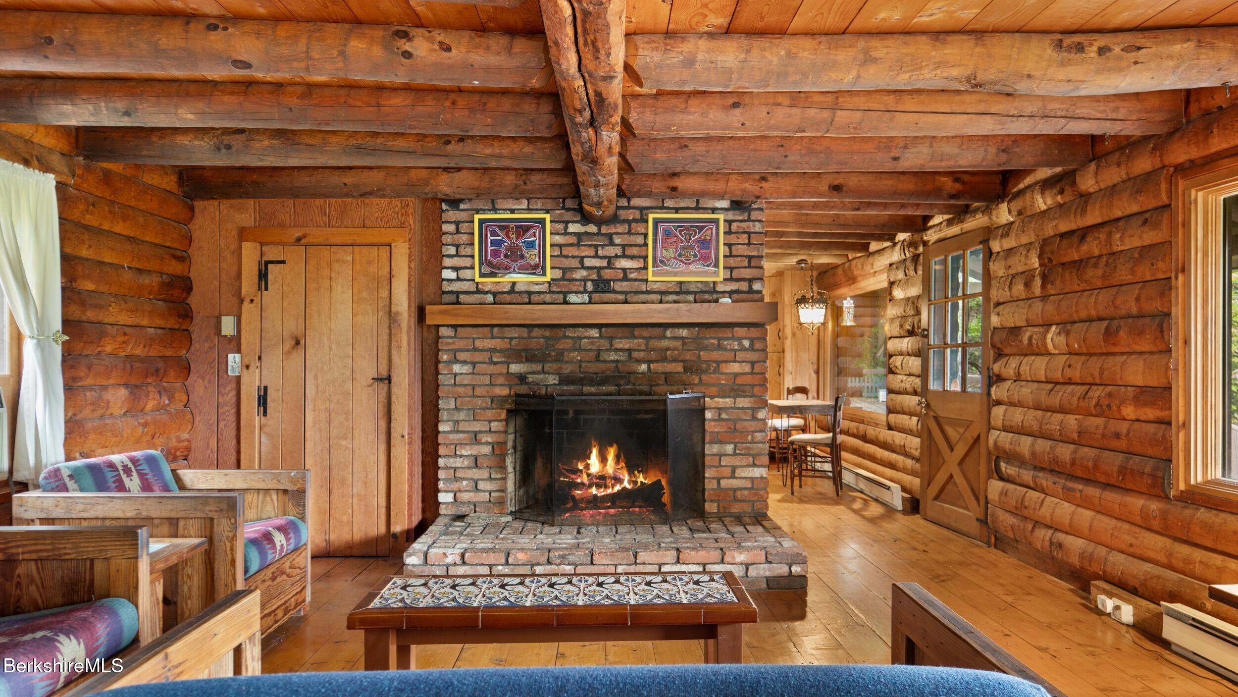 76 Corashire Road New Marlborough, MA 01230 - Photo 5 of 31 a living room with furniture and a fireplace