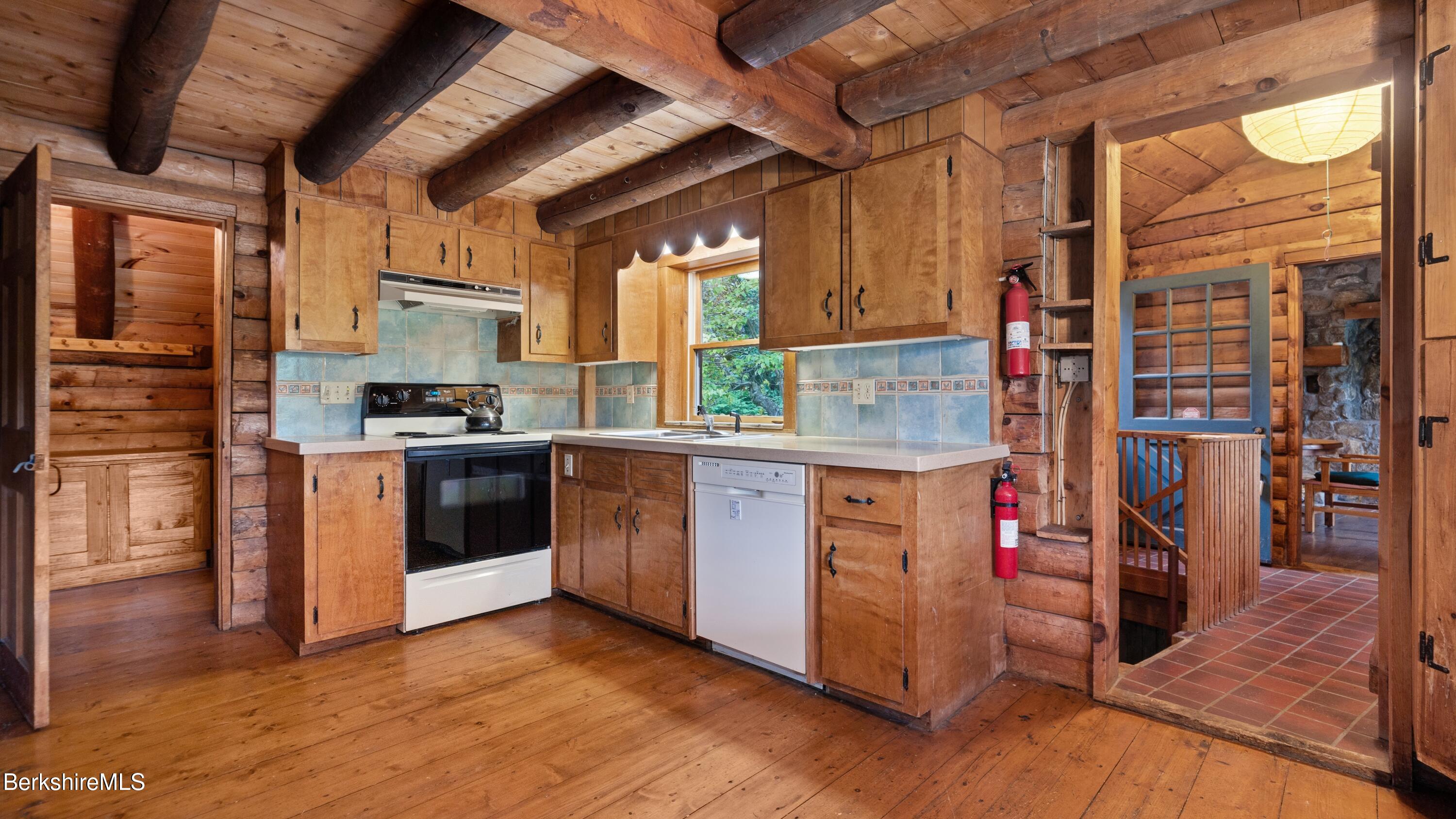 76 Corashire Road New Marlborough, MA 01230 - Photo 7 of 31 a kitchen with stainless steel appliances granite countertop a stove a sink and a refrigerator