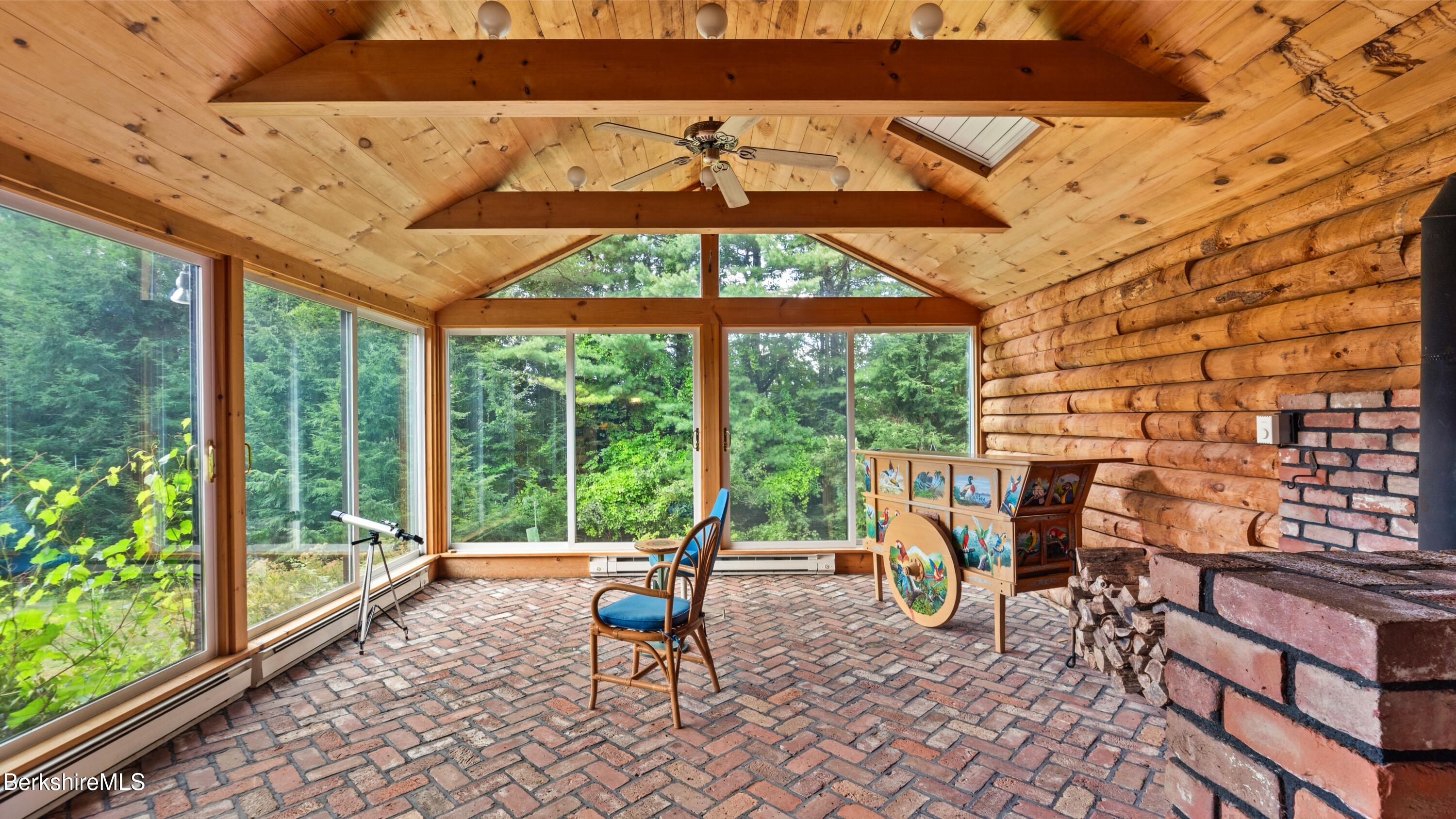 76 Corashire Road New Marlborough, MA 01230 - Photo 10 of 31 a living room filled with furniture and a large window