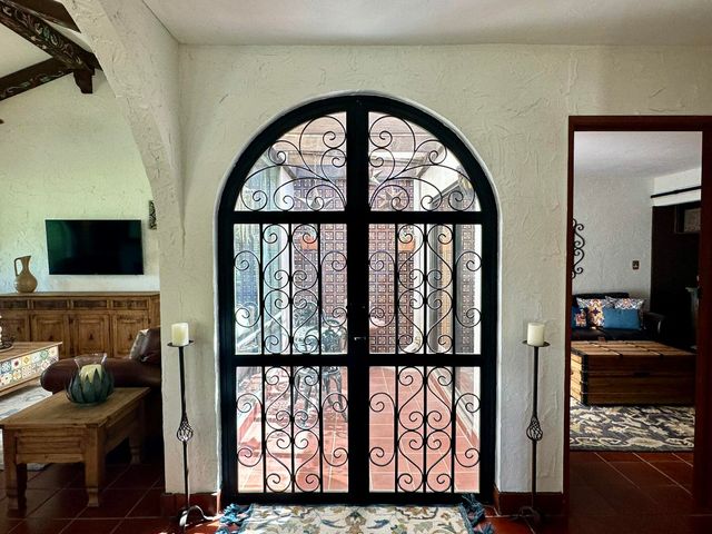 a view of living room with furniture and a flat screen tv
