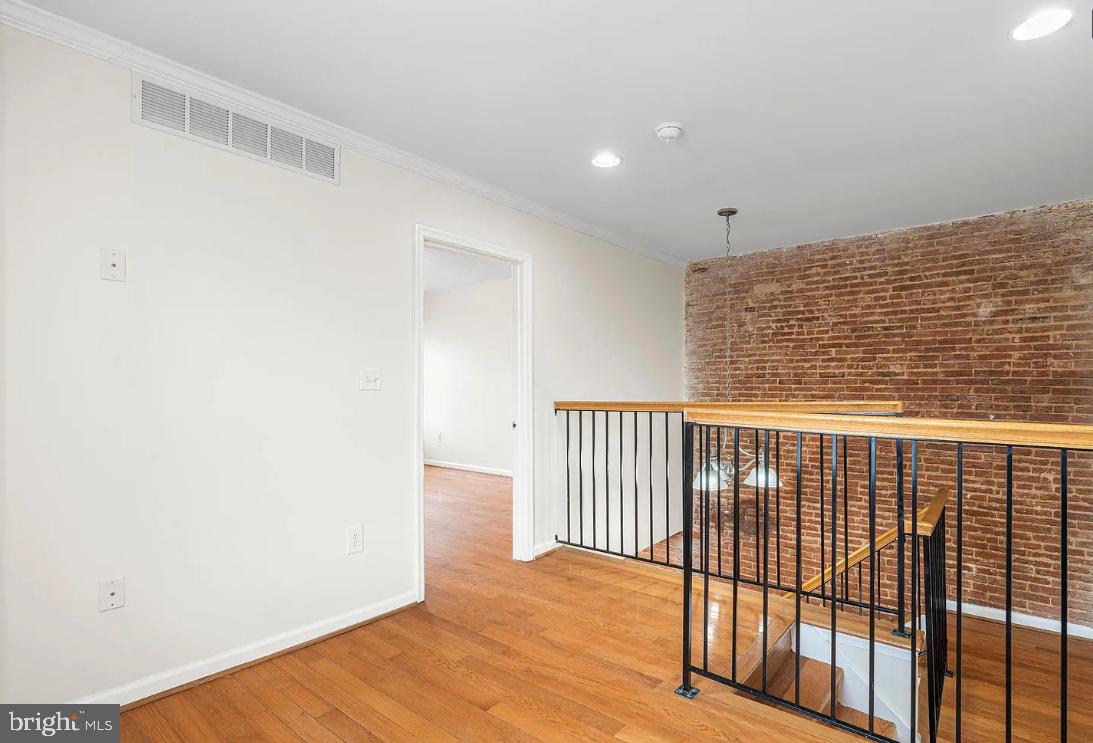 1401 Druid Hill Avenue, Unit B Baltimore, MD 21217 - Photo 14 of 23 a view of a room with wooden floor