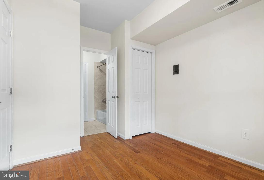 1401 Druid Hill Avenue, Unit B Baltimore, MD 21217 - Photo 17 of 23 a view of empty room with wooden floor