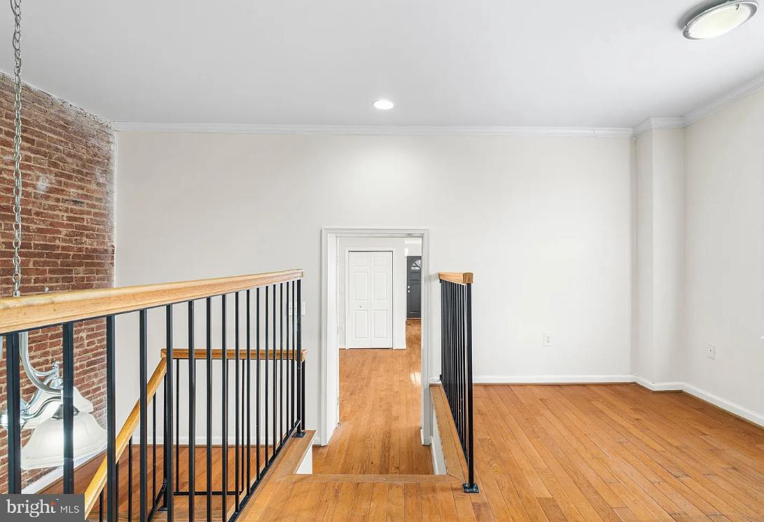 1401 Druid Hill Avenue, Unit B Baltimore, MD 21217 - Photo 5 of 23 a view of hallway with wooden floor