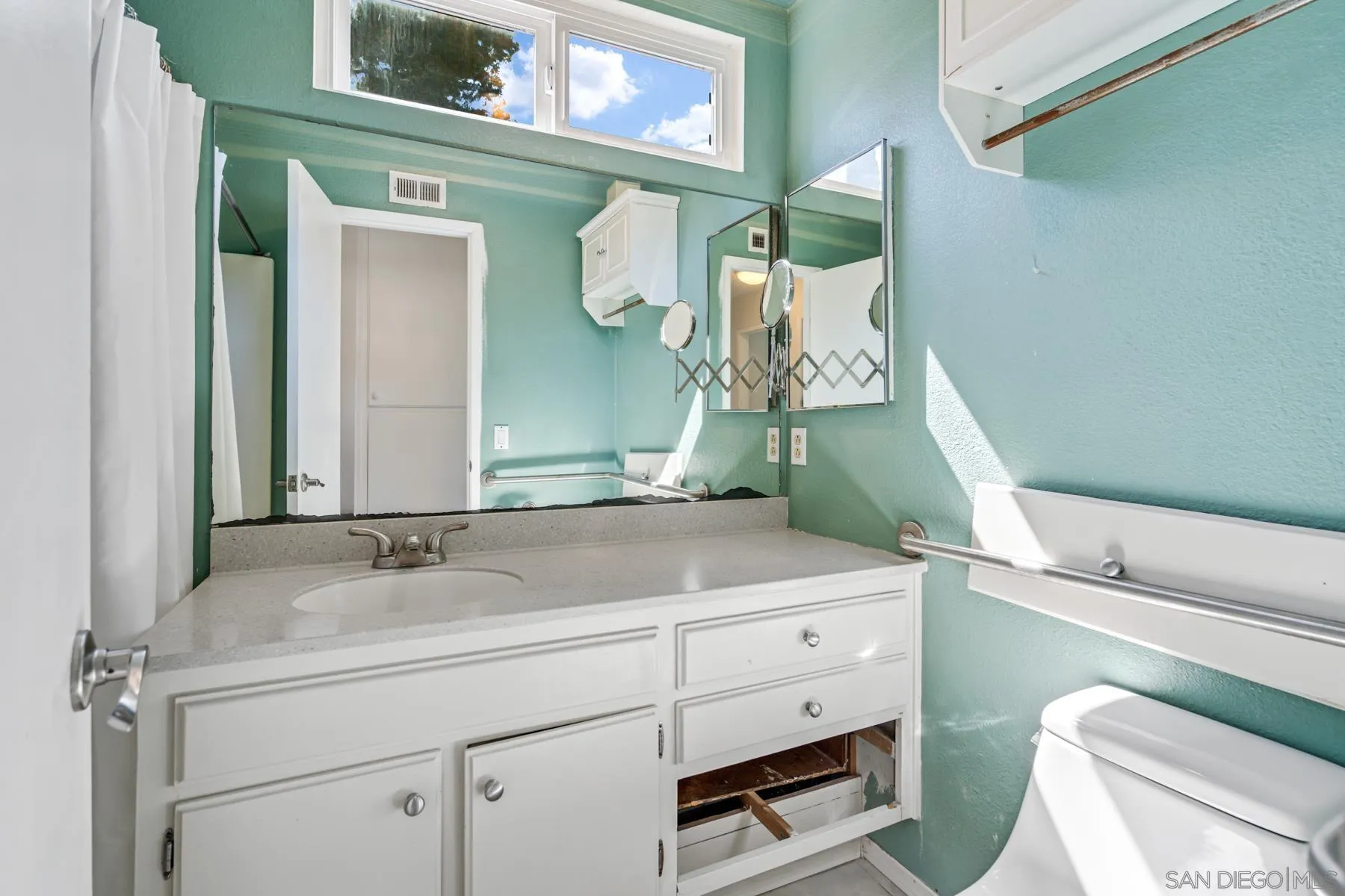 13246 Powers Court Poway, CA 92064 - Photo 20 of 39 a bathroom with a sink and a mirror