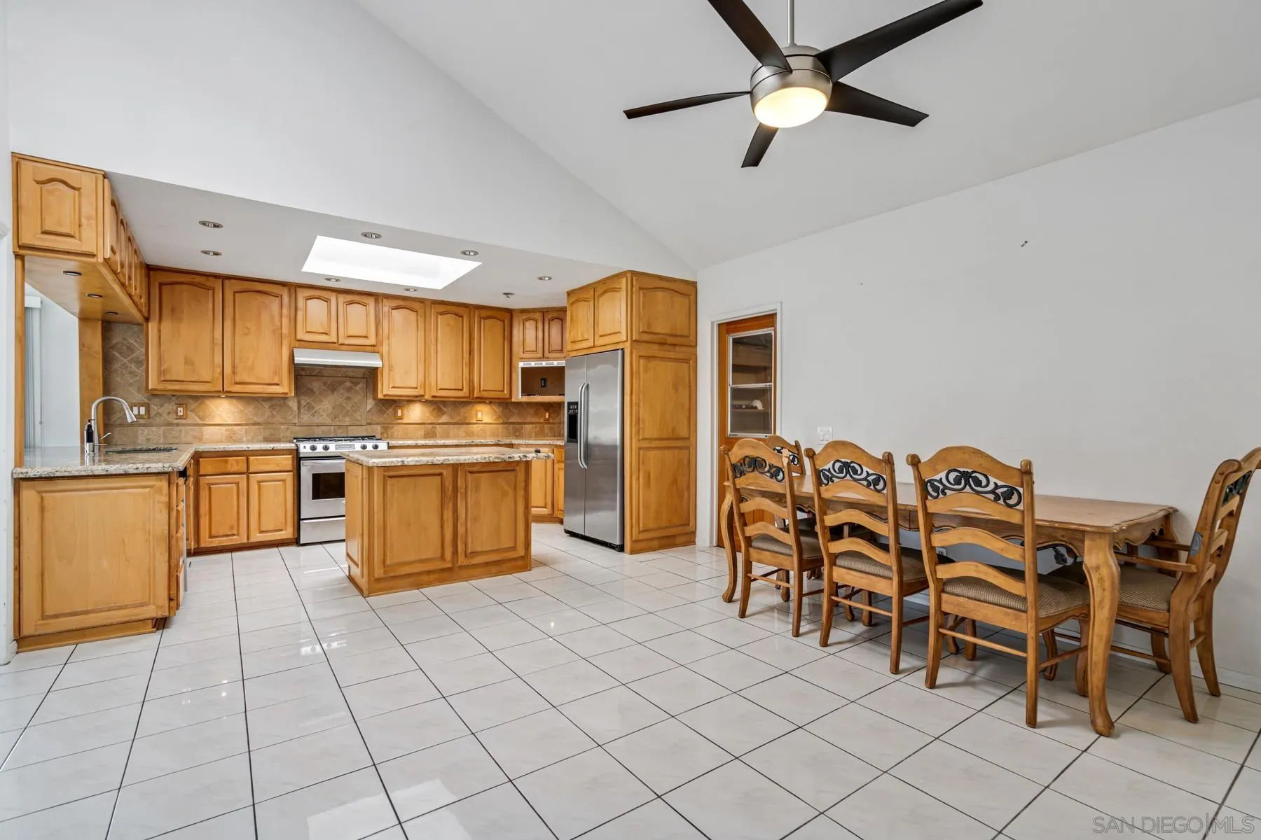 13246 Powers Court Poway, CA 92064 - Photo 4 of 39 a kitchen with stainless steel appliances a stove a sink dishwasher and a refrigerator