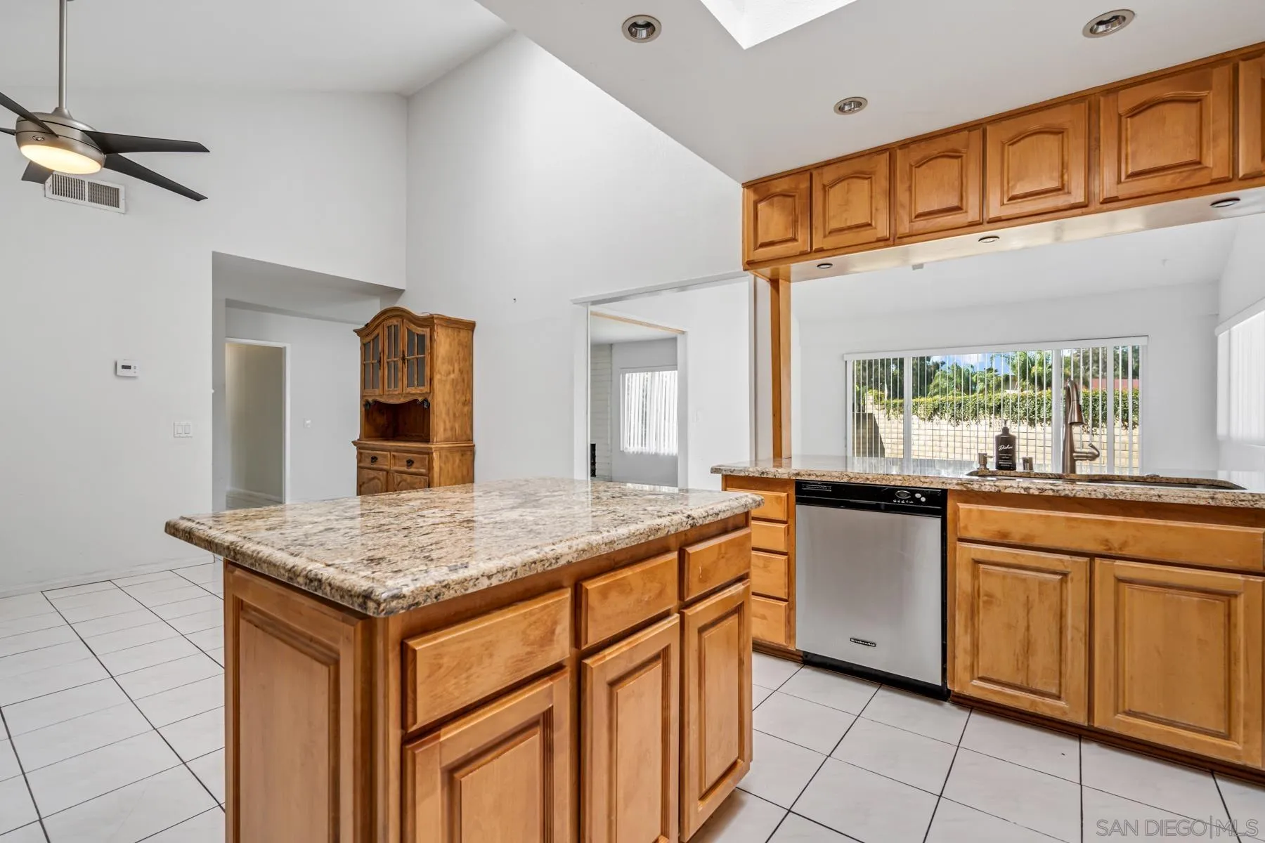 13246 Powers Court Poway, CA 92064 - Photo 7 of 39 a kitchen that has a sink and chairs in it