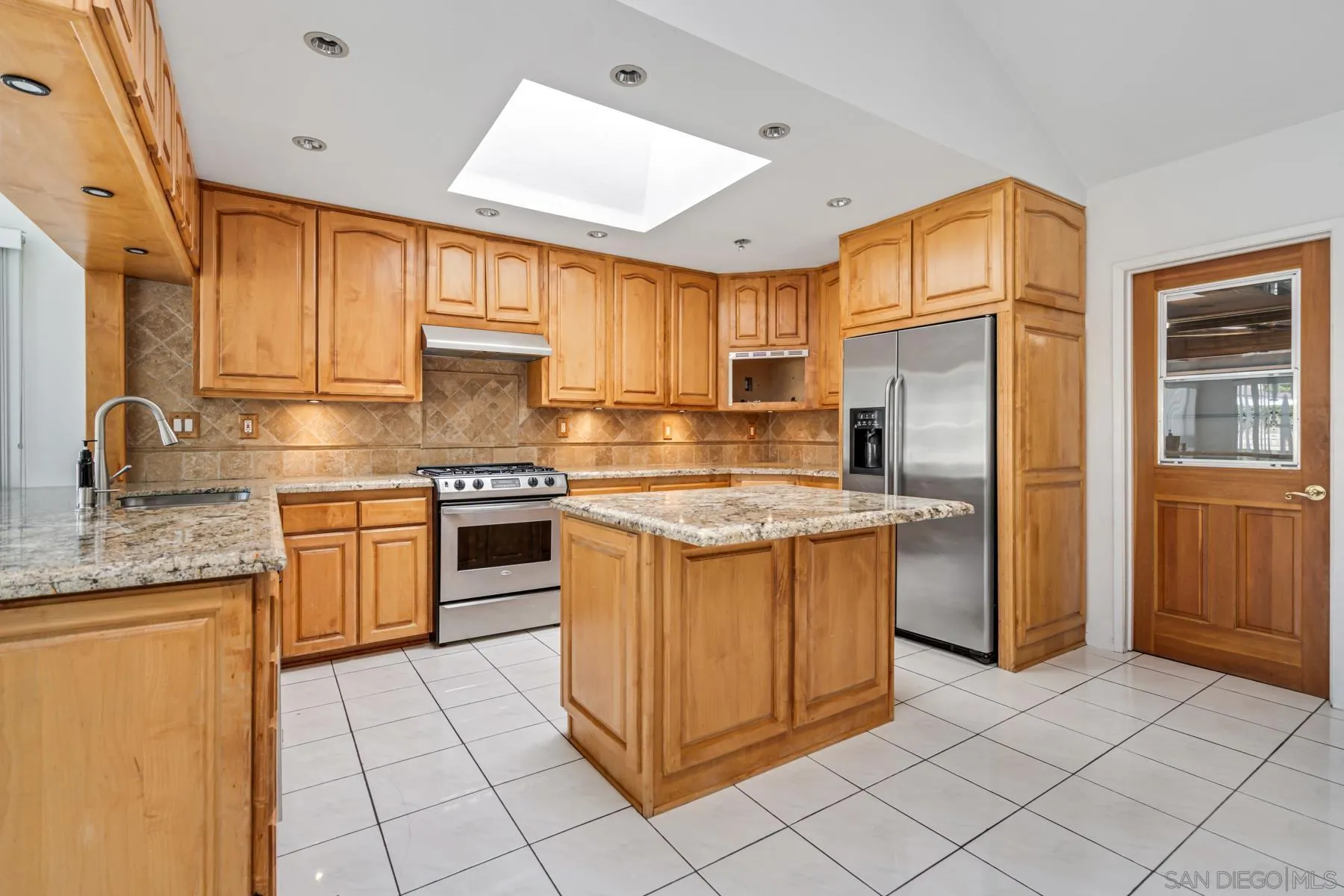 13246 Powers Court Poway, CA 92064 - Photo 8 of 39 a kitchen with stainless steel appliances granite countertop a stove a sink and a refrigerator