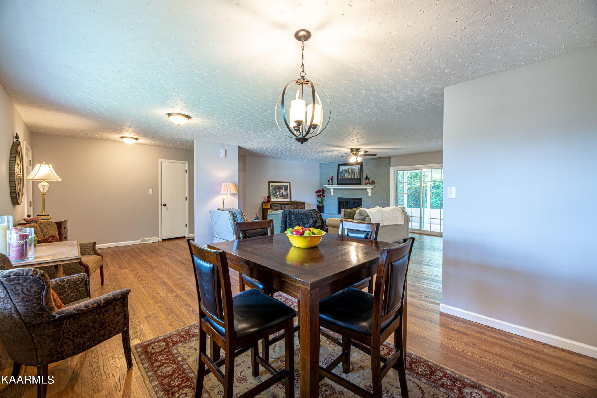 600 Schenley Road Knoxville, TN 37923 - Photo 12 of 38 a view of a dining room with furniture a chandelier and wooden floor