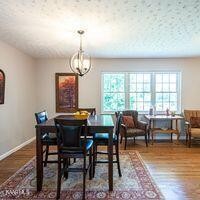 600 Schenley Road Knoxville, TN 37923 - Photo 14 of 38 a view of a dining room with furniture window and wooden floor
