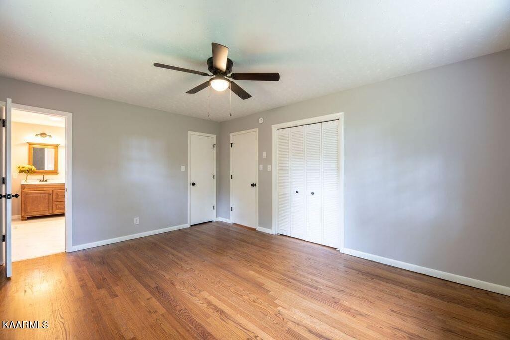 600 Schenley Road Knoxville, TN 37923 - Photo 16 of 38 a view of room with wooden floor and ceiling fan