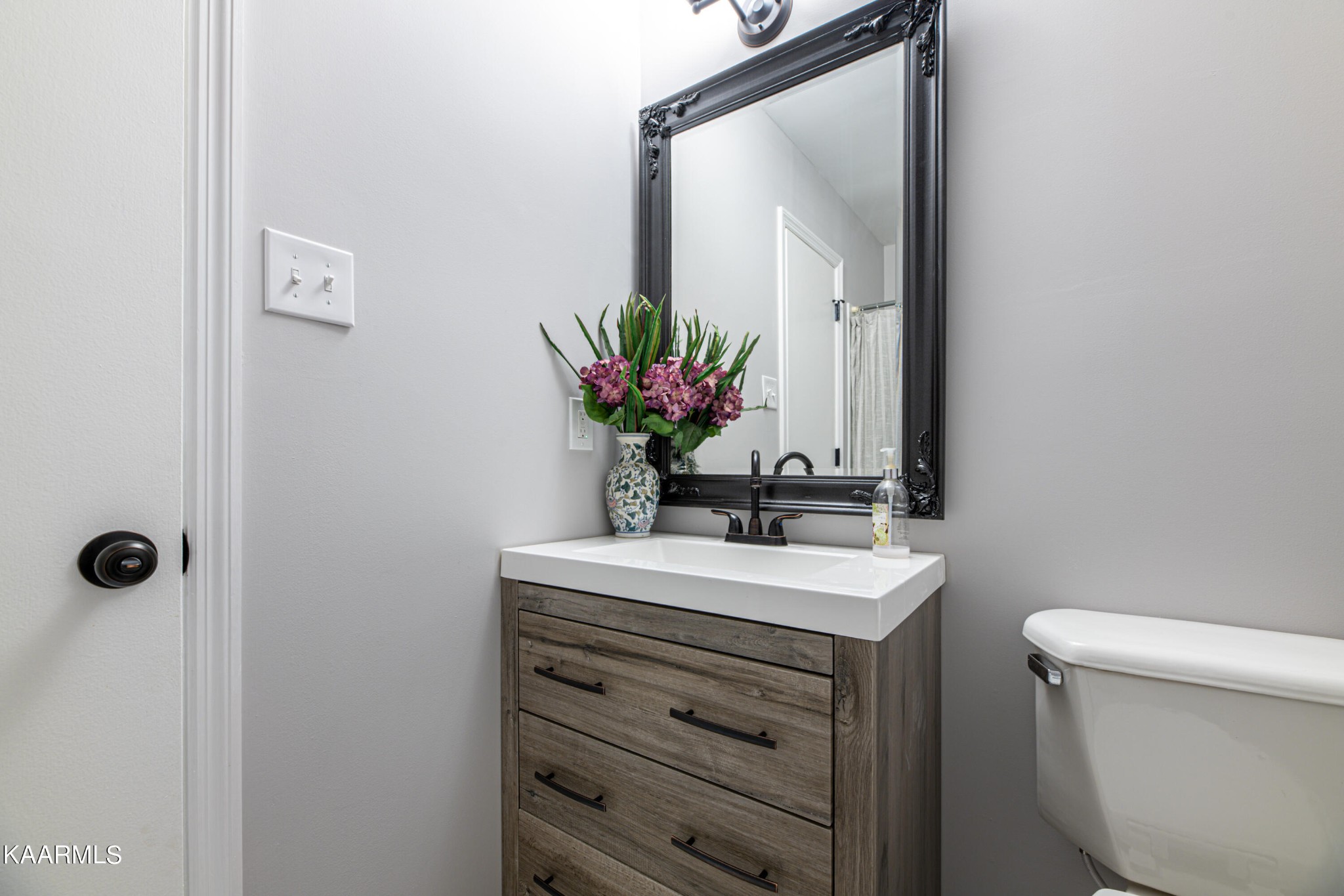 600 Schenley Road Knoxville, TN 37923 - Photo 22 of 38 a bathroom with a sink a toilet and mirror