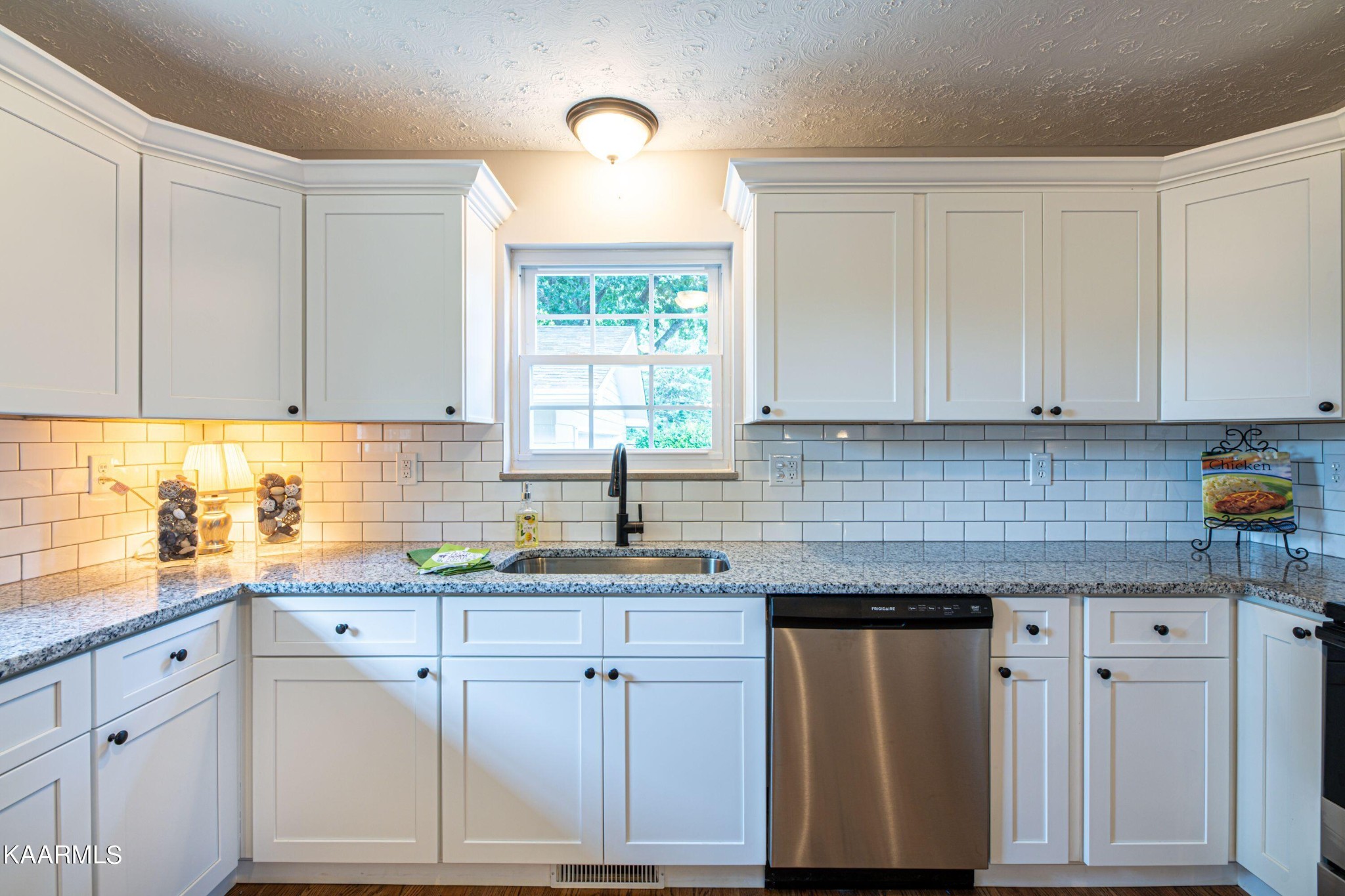 600 Schenley Road Knoxville, TN 37923 - Photo 5 of 38 a kitchen with granite countertop white cabinets white appliances and a sink