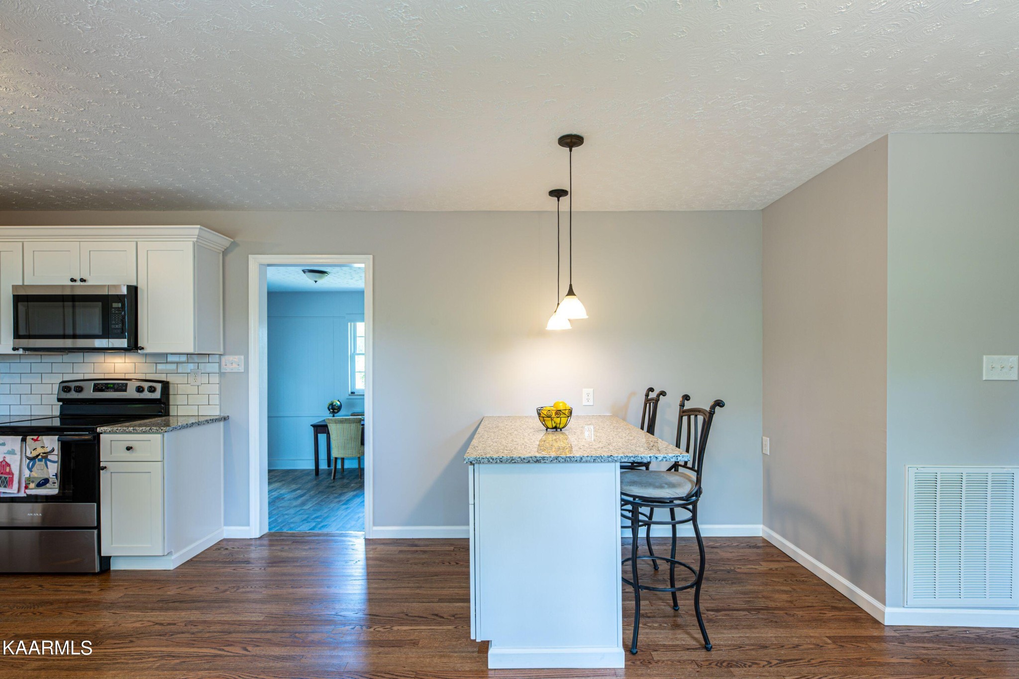 600 Schenley Road Knoxville, TN 37923 - Photo 8 of 38 a view of a dining room with furniture wooden floor and a chandelier