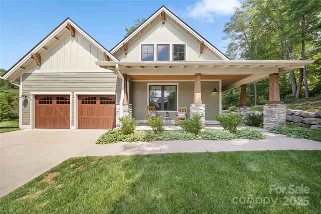 a front view of a house with a yard and porch