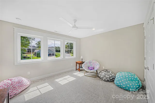 a bedroom with furniture and a window