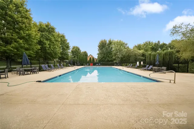 a view of a swimming pool with an outdoor seating