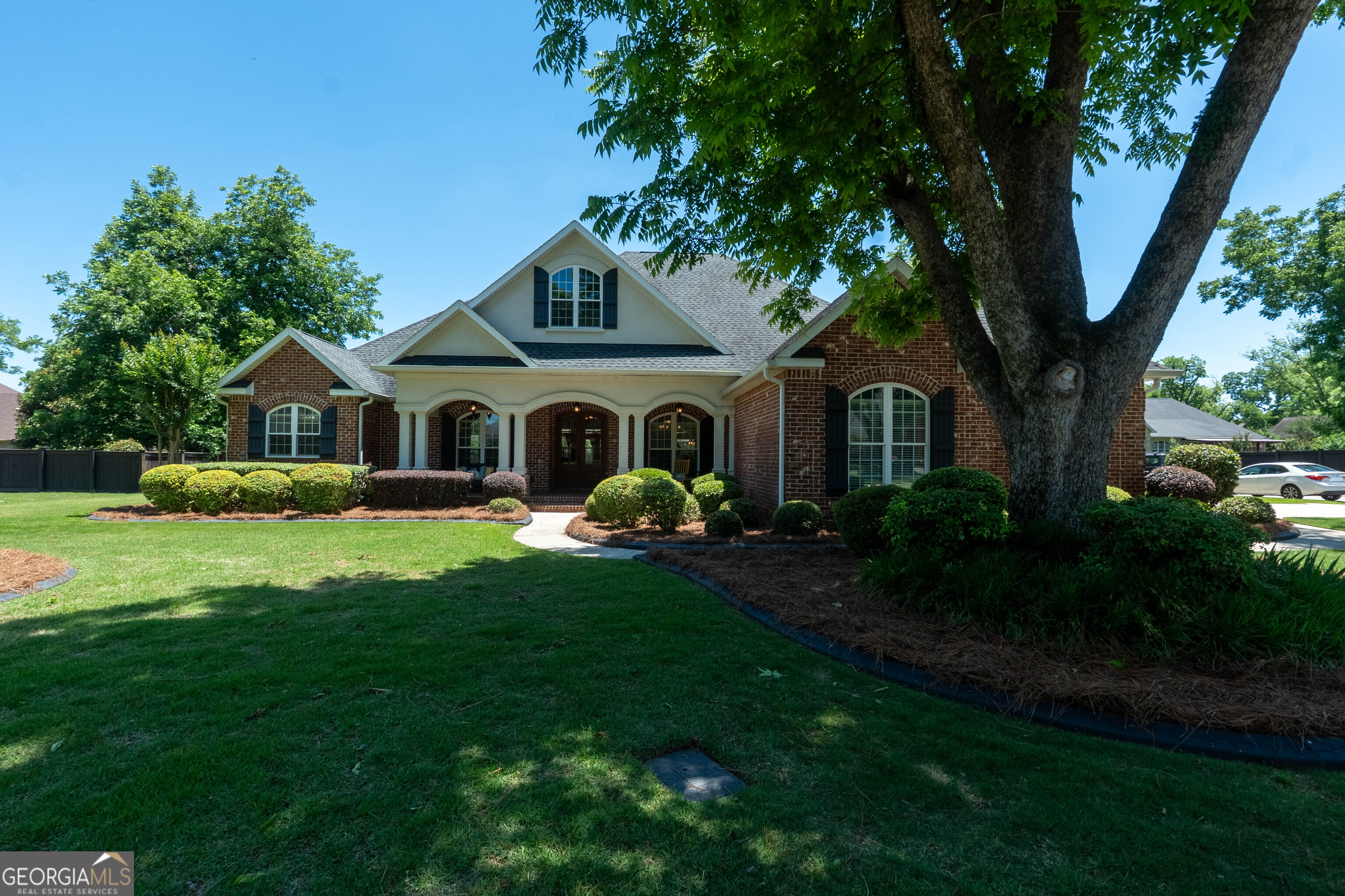 501 Old Bridge Road Warner Robins, GA 31088 - Photo 1 of 54 a front view of a house with garden