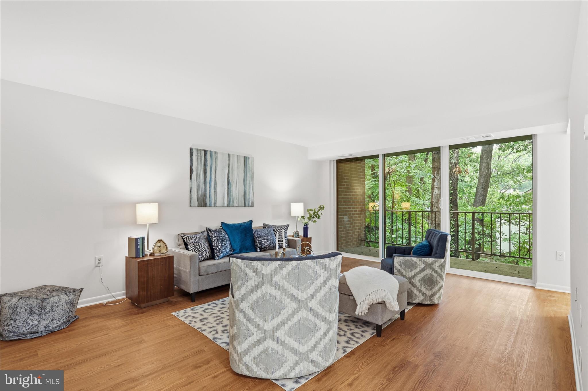 a bed room with a bed and a large window