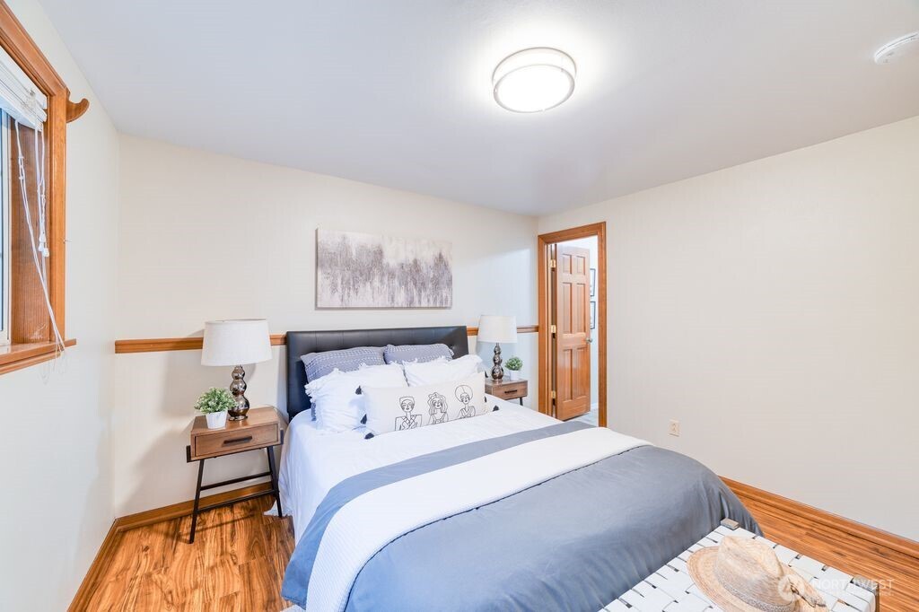 718 East Walnut Street Kent, WA 98030 - Photo 11 of 29 a bedroom with a bed and a window